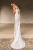A woman wearing a strapless white lace wedding gown with a long train_XS_