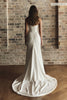 A woman wears a structured corset-style bodice and a long wedding skirt_XS_