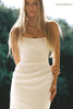 A woman wearing a strapless white wedding gown with a draped bodice and floor-length silhouette_xs_