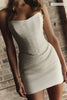 A woman wears a structured corset-style bodice and a short wedding skirt_XS_