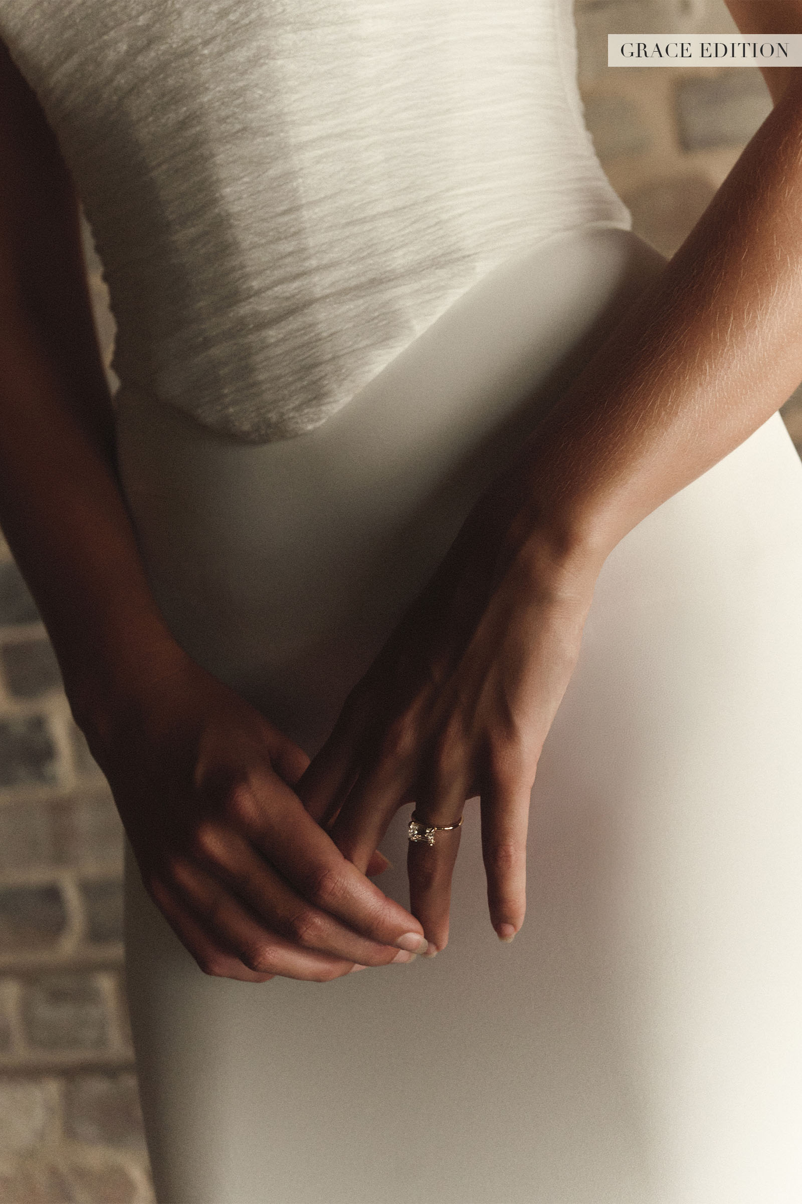 A woman wears a structured corset-style bodice and a short wedding skirt_XS_