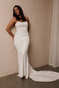 A woman wearing a strapless white mermaid style gown_L_