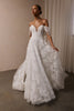 A woman wearing a white off-the-shoulder lace wedding gown with a deep V neckline and a full layered skirt_XS_