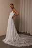 woman wearing a white lace backless dress with thin straps and delicate chain jewellery across her back