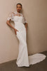 A woman wearing a strapless white mermaid style gown_L_
