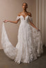 A woman wearing a white off-the-shoulder lace wedding gown with a deep V neckline and a full layered skirt_XS_