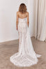 Woman wearing a lace wedding dress with a long train_XS_