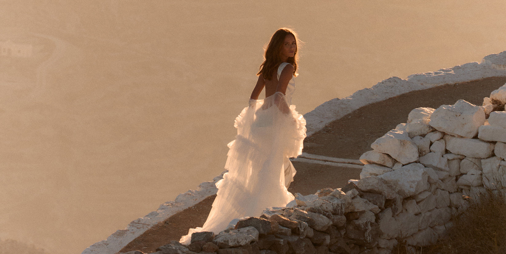 wedding dress in the sunset with a bridal gown